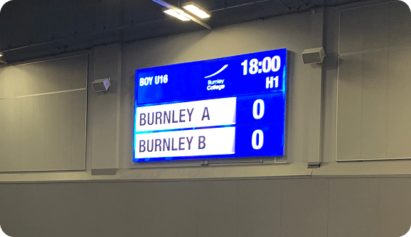 Wall-mounted LED scoreboard fixed securely for indoor and outdoor sports venues.